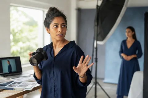 Indian photographer directing a studio portrait session