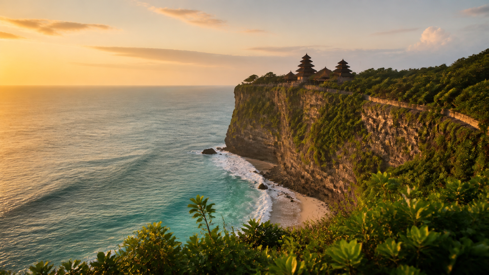 Bali clifftop temple overlooking a turquoise ocean at sunset
